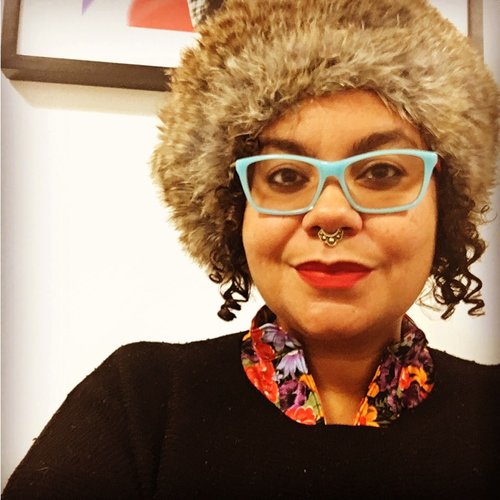 portrait of Adrienne against a white wall