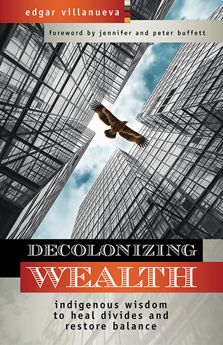 Decolonizing Wealth cover. Upward view of a large bird flying between glass skyscrapers