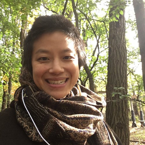 portrait of Marsha against a backdrop of tree leaves