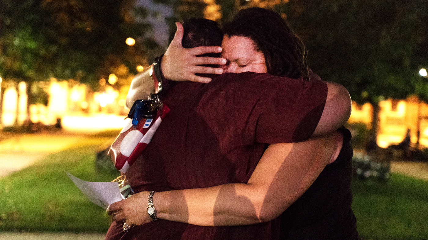 Two people sharing a hug