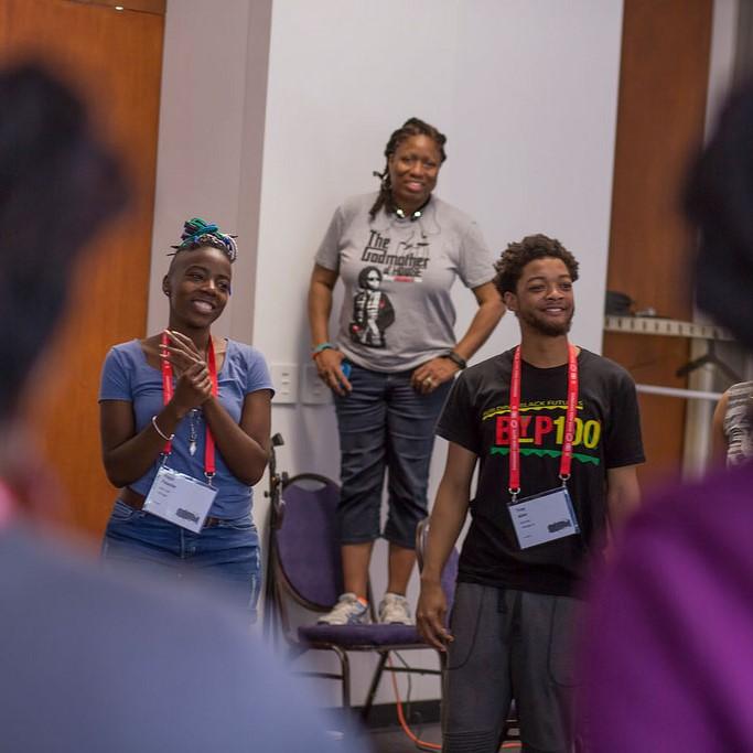 photo of 3 AMC attendees smiling during an AMC session